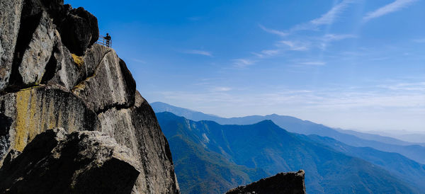 Scenic view of mountains against blue sky