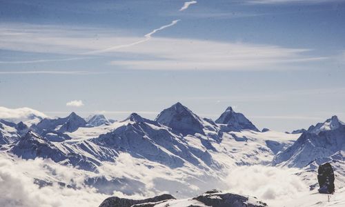 Scenic view of snowcapped mountains against sky