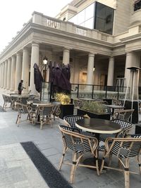 Rear view of people in front of building