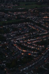 High angle view of illuminated buildings in city at night