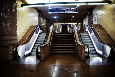 Staircase in illuminated corridor