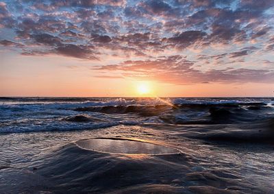 Scenic view of sea against sky during sunset