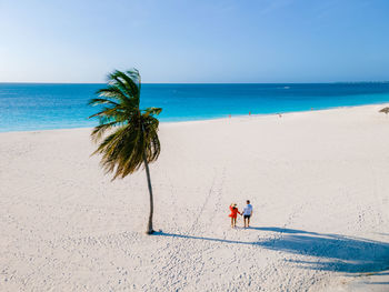 Scenic view of beach against clear sky