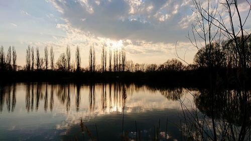 Scenic view of lake against sky during sunset