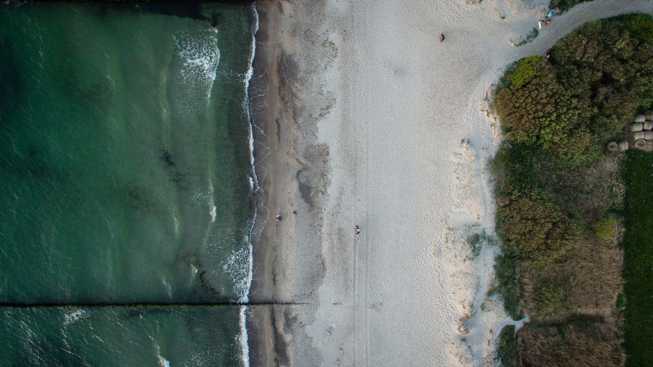 HIGH ANGLE VIEW OF BEACH SEEN THROUGH WINDOW