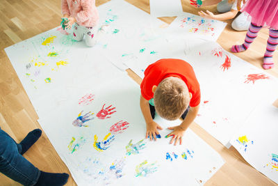 High angle view of children on table