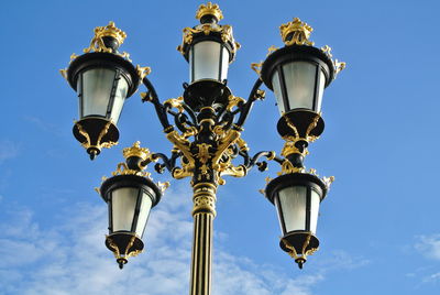 Low angle view of street light against sky