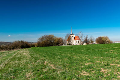 Church on field against sky