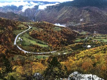 High angle view of road amidst trees and mountains