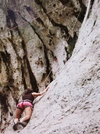 Low section of person on rock