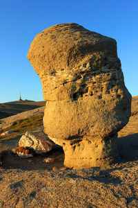 Rock formation against clear blue sky at bucegi natural park