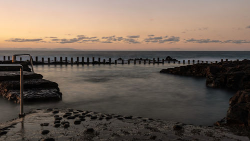 Scenic view of sea against sky during sunset