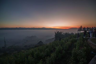 Scenic view of landscape against sky during sunset