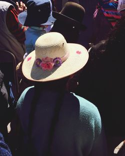 Close-up of people sitting on wall