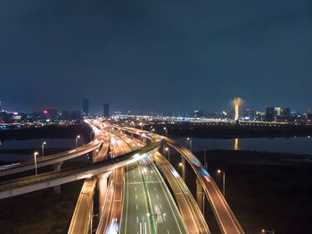 High angle view of illuminated bridge at night