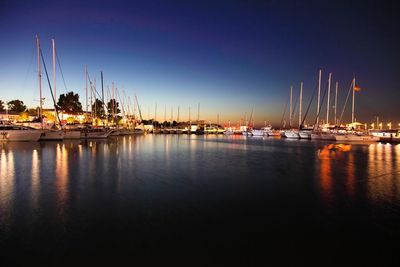 Boats moored at harbor