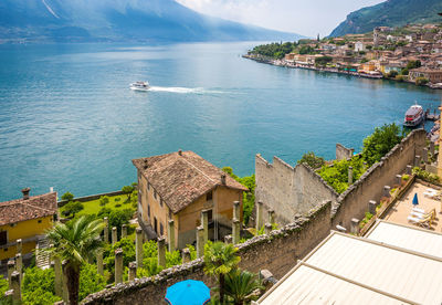 High angle view of buildings by sea