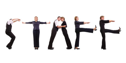 Friends standing against white background