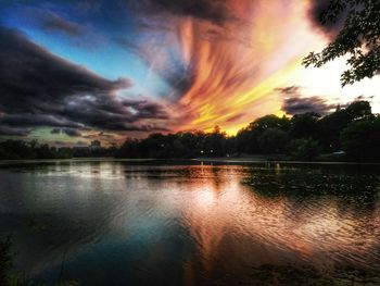 Scenic view of lake against orange sky