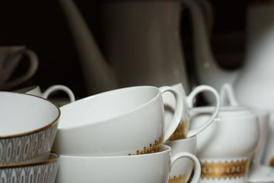 Close-up of coffee cups on table