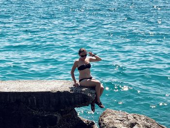 Full length of young woman on beach