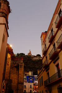 Low angle view of buildings against clear sky