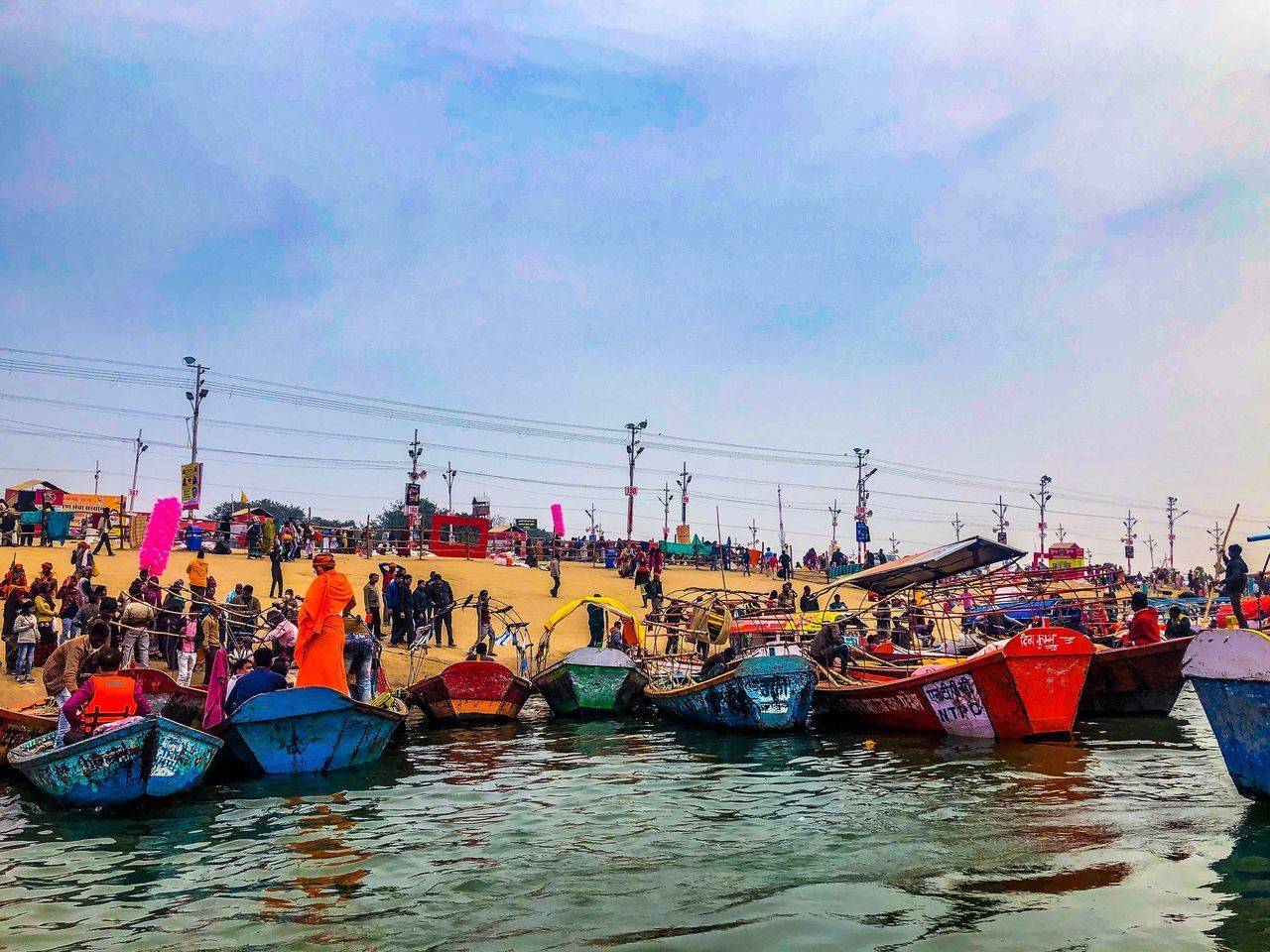 BOATS MOORED AT HARBOR