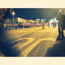 People on city street at night