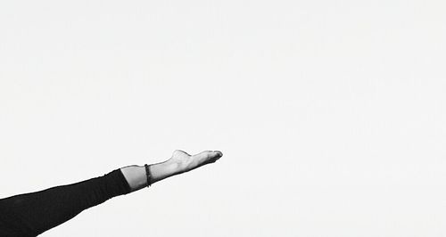 Cropped image of hand against white background