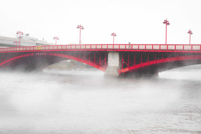 Bridge over river against sky