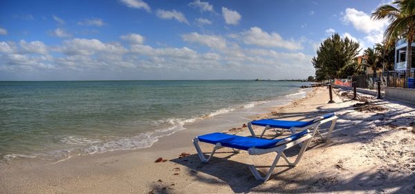Beach chairs overlook the ocean at anna maria beach on anna maria island, florida.