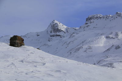 Snow covered mountain against sky