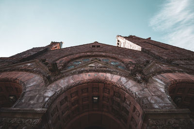 Low angle view of old building against sky