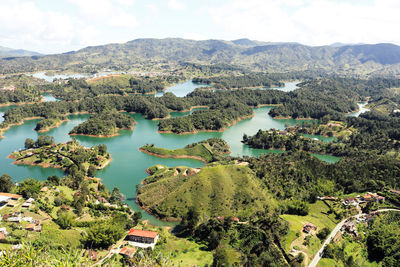 High angle view of plants and mountains against sky
