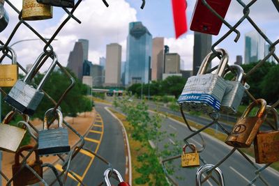 Clothes hanging in city against sky