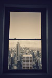 View of cityscape through window