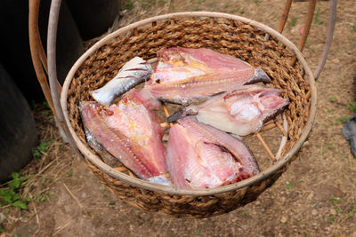 Fresh fish in a basket put to dry in the sun. thai food preservation.