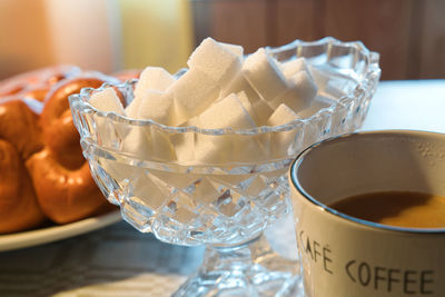 Tea time, white sugar cubes on the table