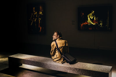 Man sitting on statue