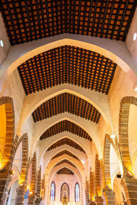 Low angle view of illuminated ceiling of building