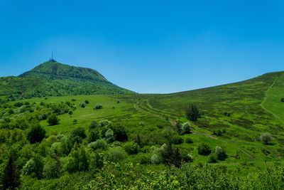 Scenic view of landscape against clear blue sky