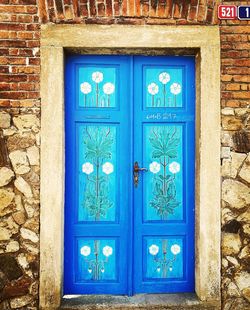 Closed blue door of house