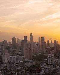 Panorama of cityscape with sunset over the building and blue sky at bangkok ,thailand.