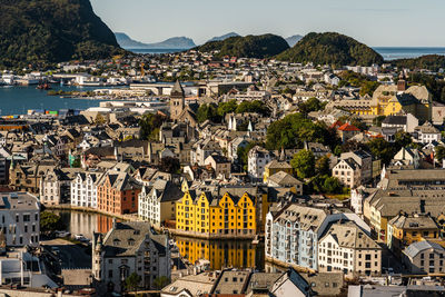 High angle view of townscape by sea