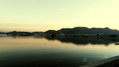 Scenic view of lake at sunset