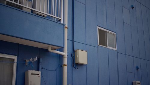 Low angle view of building against blue sky