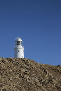 Low angle view of lighthouse against clear sky