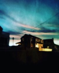 Low angle view of house against blue sky
