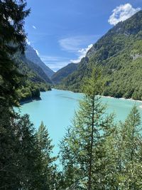 Scenic view of lake and mountains against sky