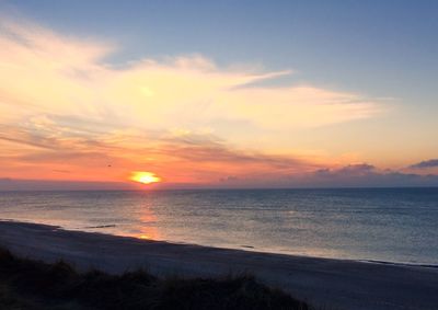 Scenic view of sea at sunset